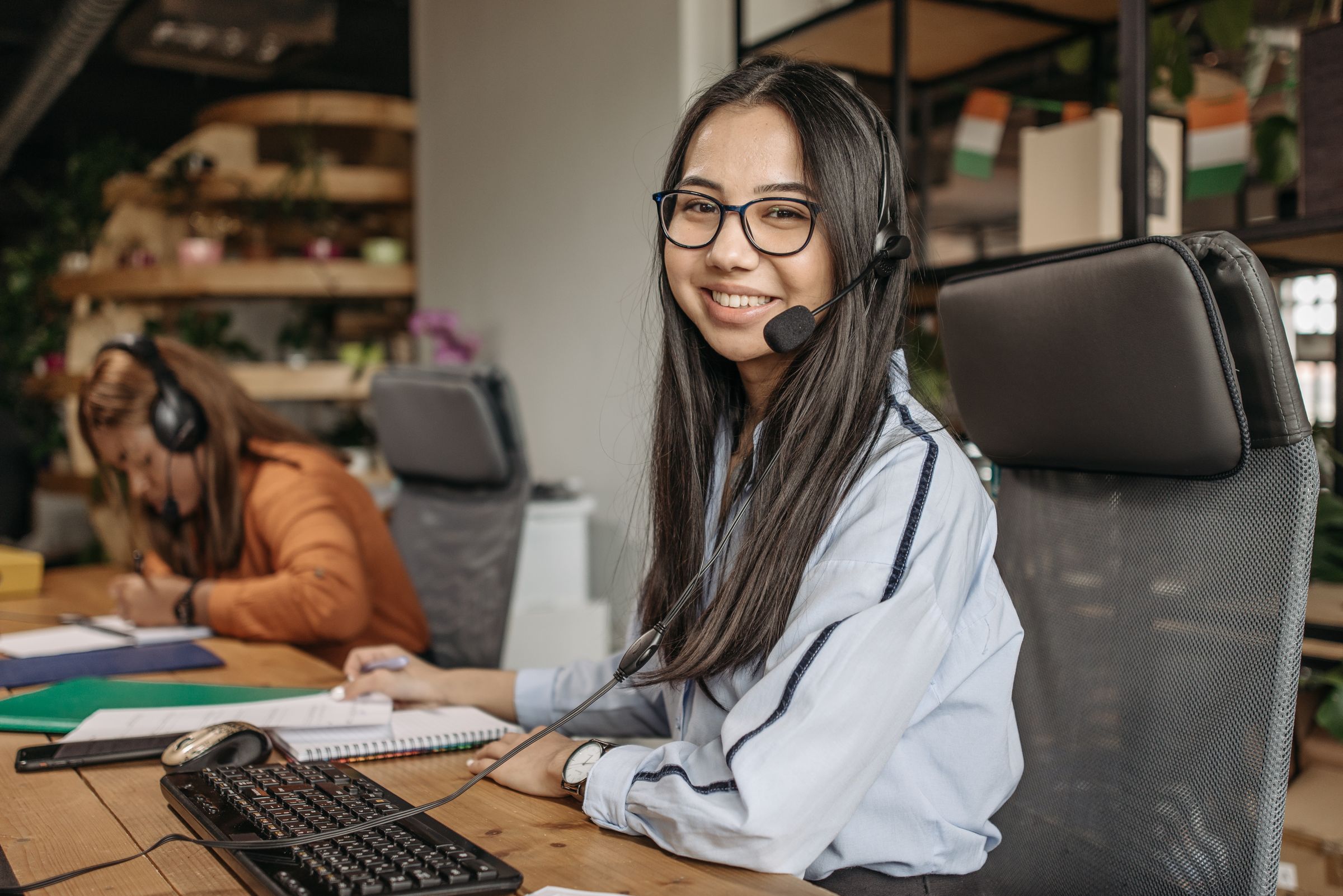 Friendly customer support specialist wearing a headset